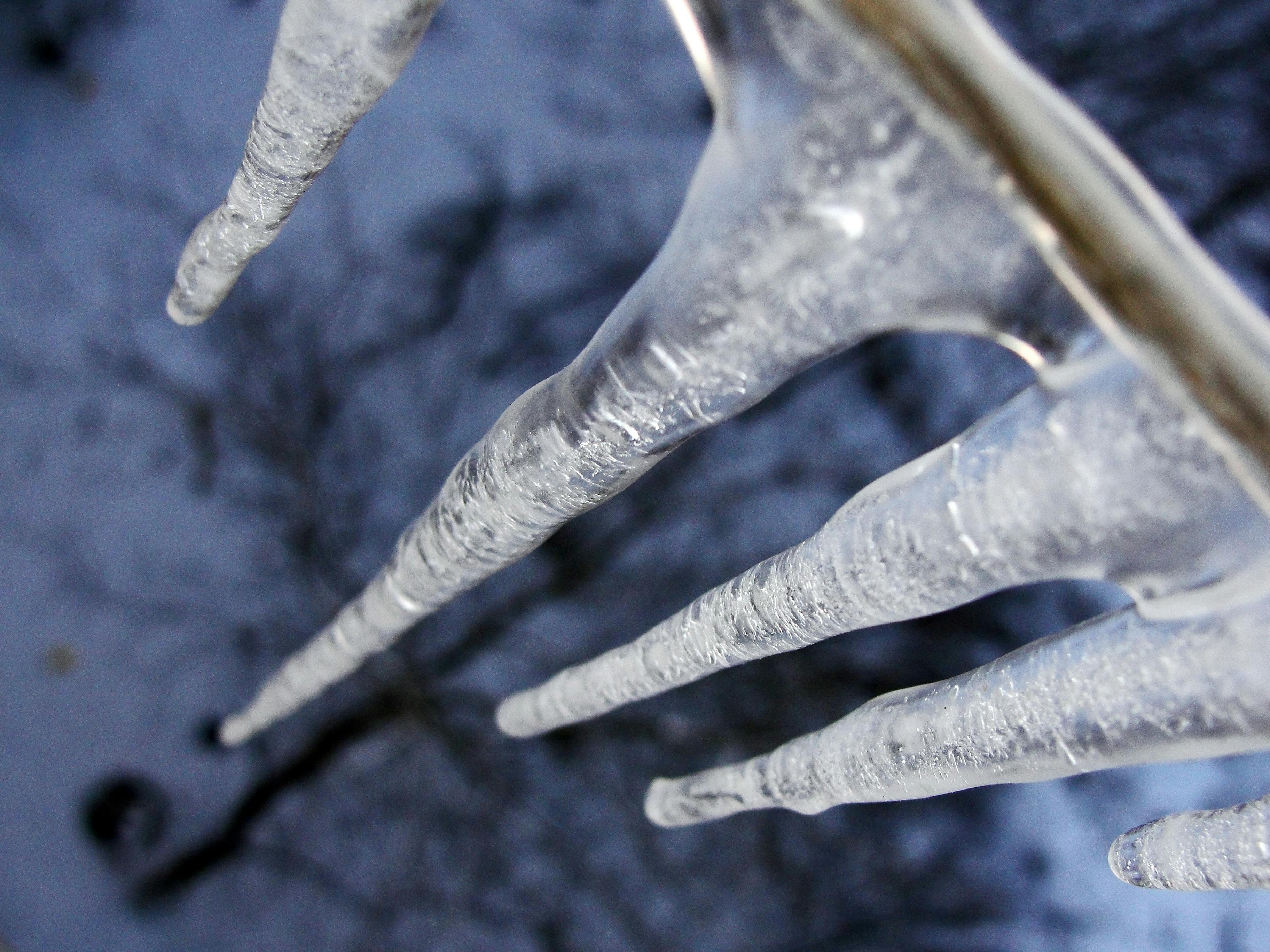 Photo of Icicles Hanging from a Roof