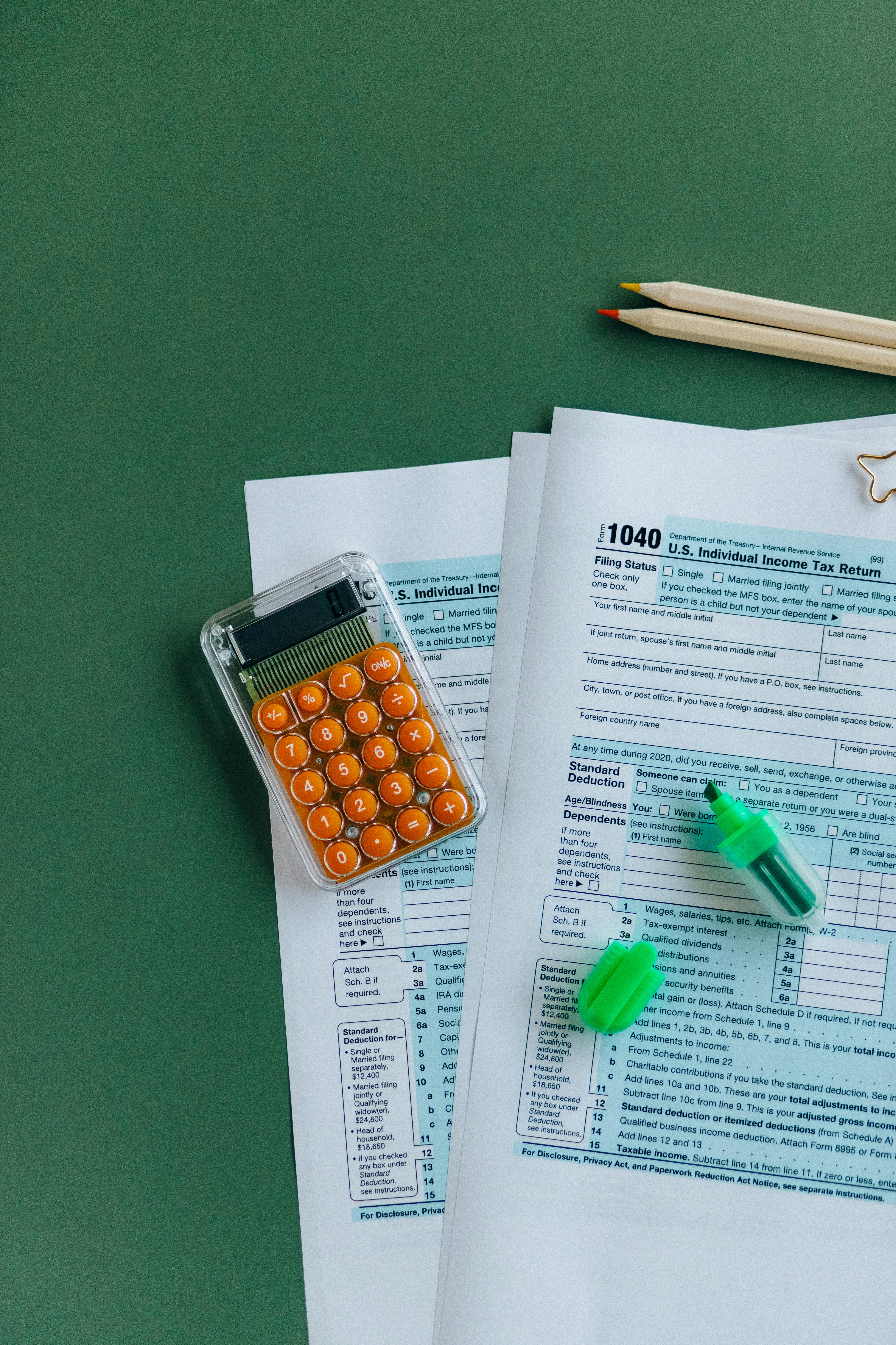 Picture of tax forms and calculator